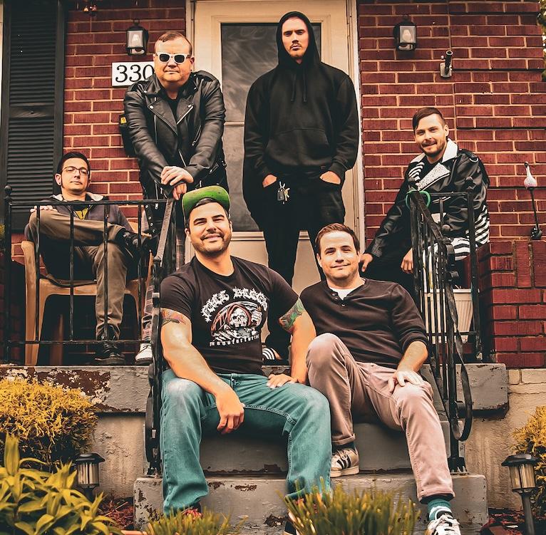 Belushi Speed Ball band photo on a front porch