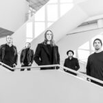 Endless Chain band photo on a white staircase